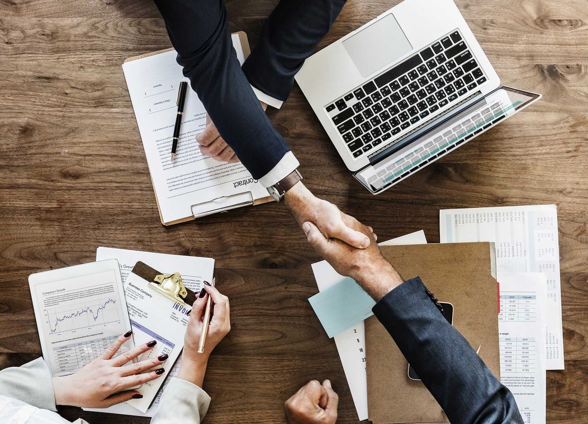 Professionals discussing financial solutions